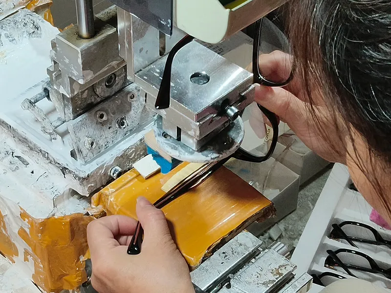 Logo application on reading glasses temple — OEM branding process