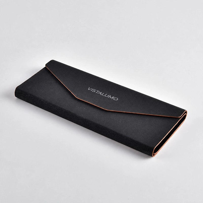Black folding case shown flat with copper edge detail