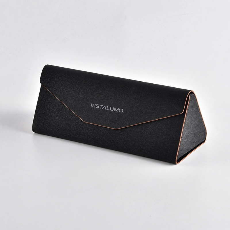 Black PU folding eyeglass case with copper trim, closed view