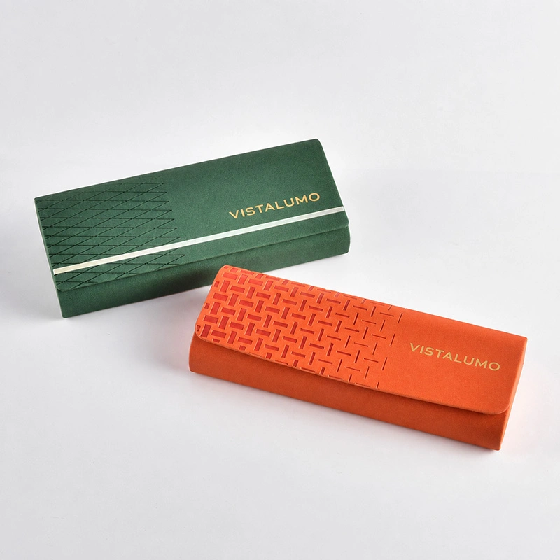 Green and orange embossed PU eyeglass cases shown closed