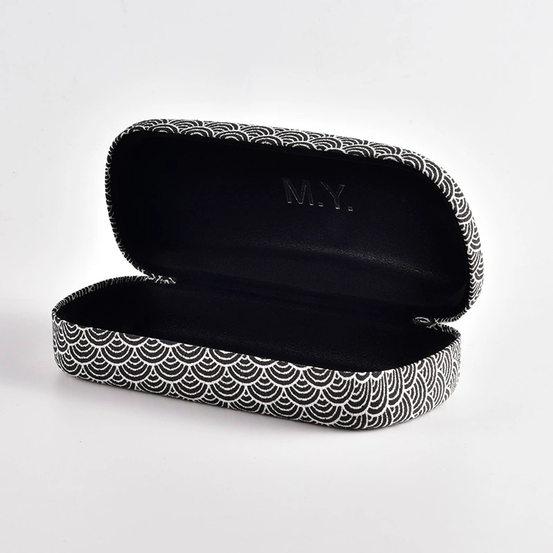 Wave pattern fabric case shown open with black lining and embossed logo